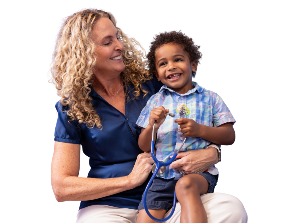 Colleen Boylston founding physician with pediatric patient